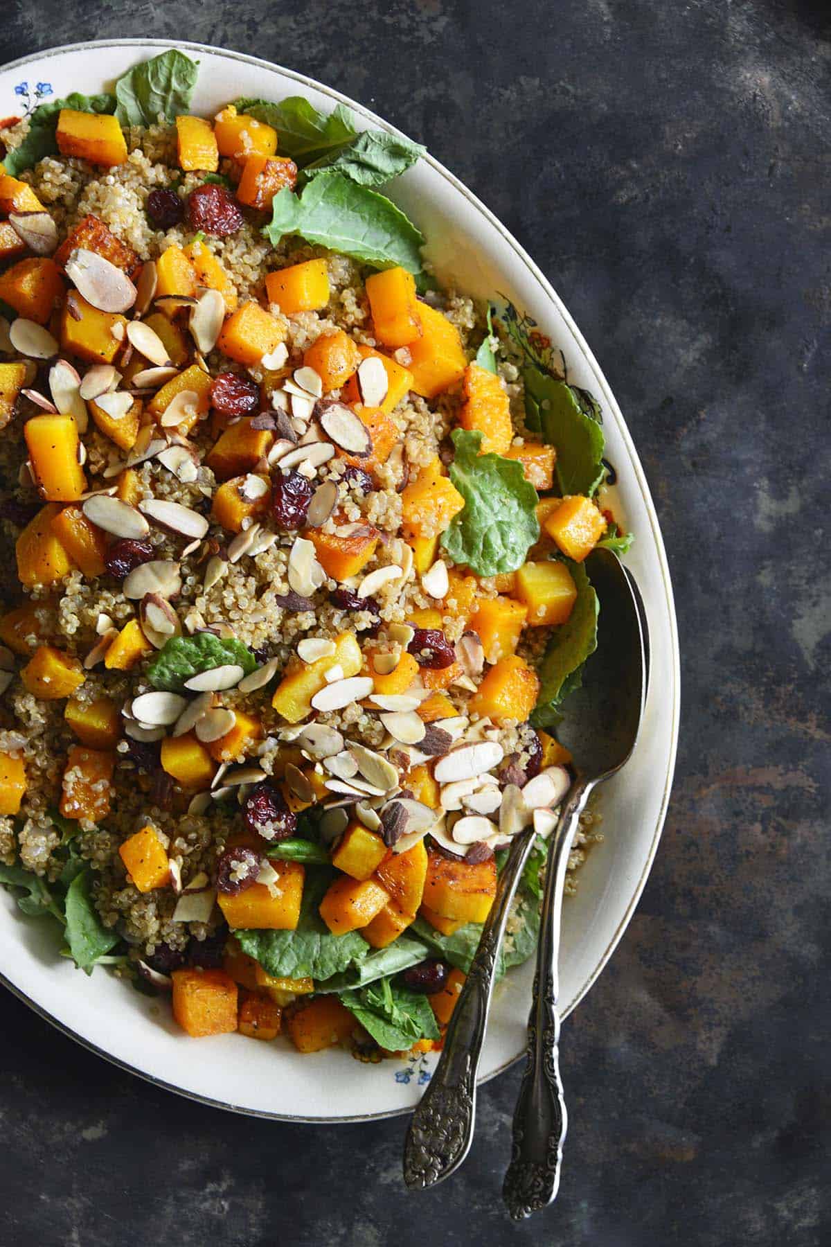 top view of platter of roasted squash salad with quinoa and cranberries