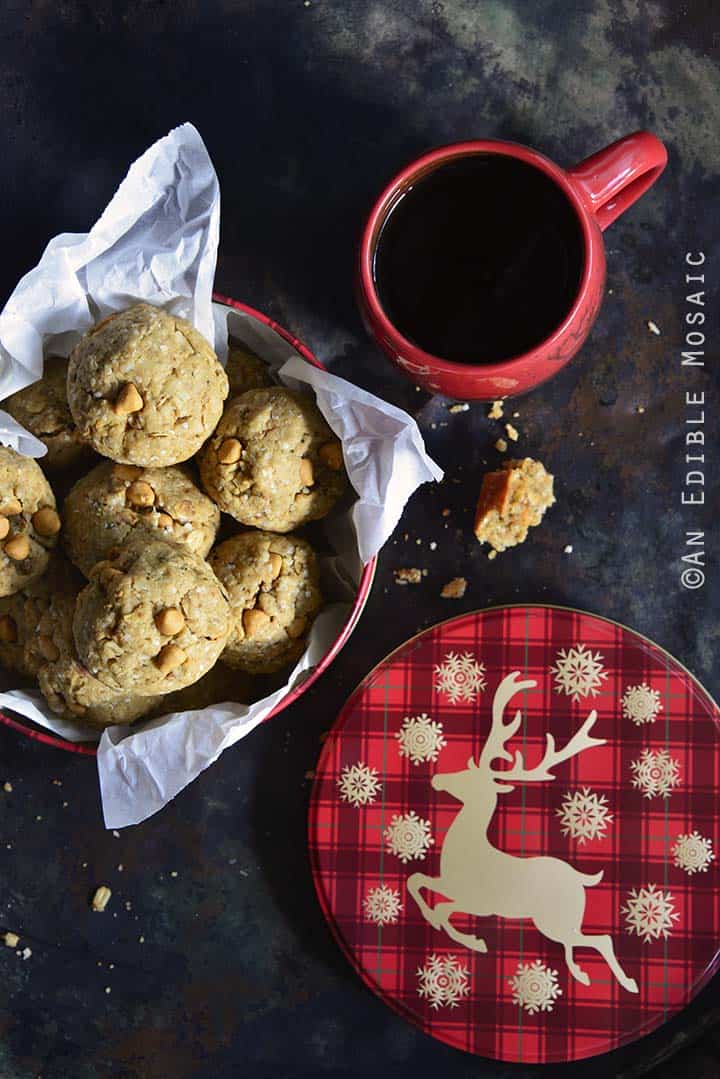 Coconut Butterscotch Granola Cookies with Festive Cookie Tin and Red Coffee Mug