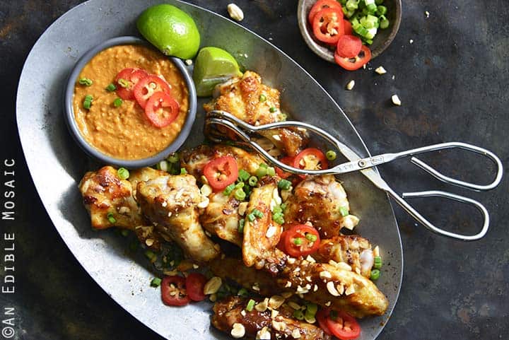 Chili-Garlic Glazed Wings with Peanutty Satay Dipping Sauce on Metal Tray