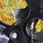 Low-Carb Keto Quiche Lorraine in Tart Dish with a Single Serving on a Plate on the Side