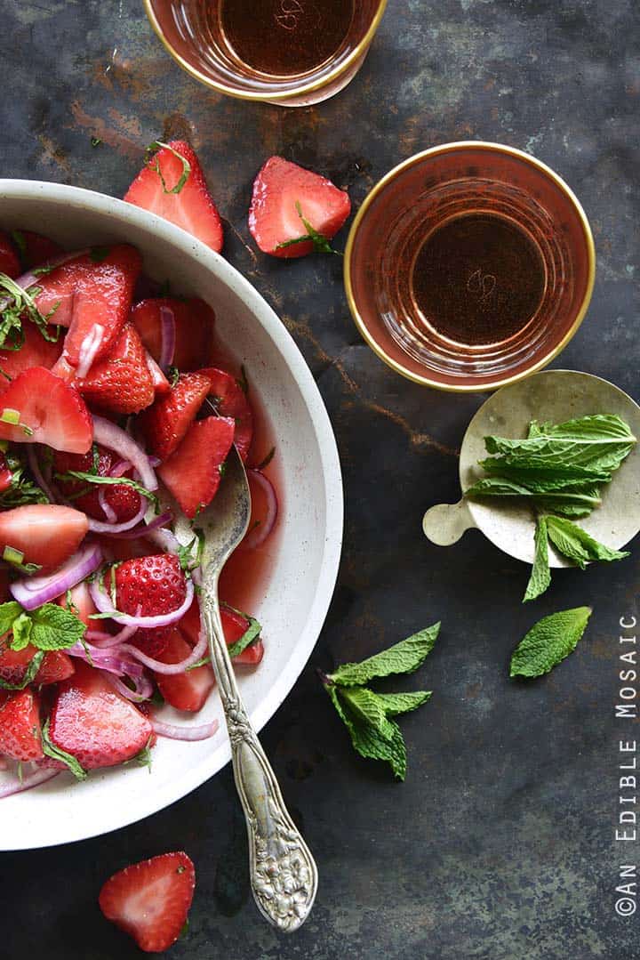 Sweet and Savory Strawberry Salad with Rosé Reduction and Fresh Mint and Glasses of Rosé