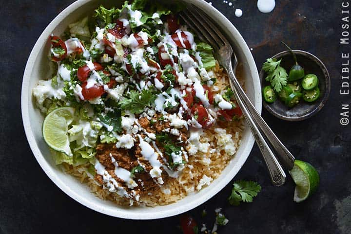 Close Up of Chorizo Refried Bean Burrito Salad Bowls with Queso Fresco