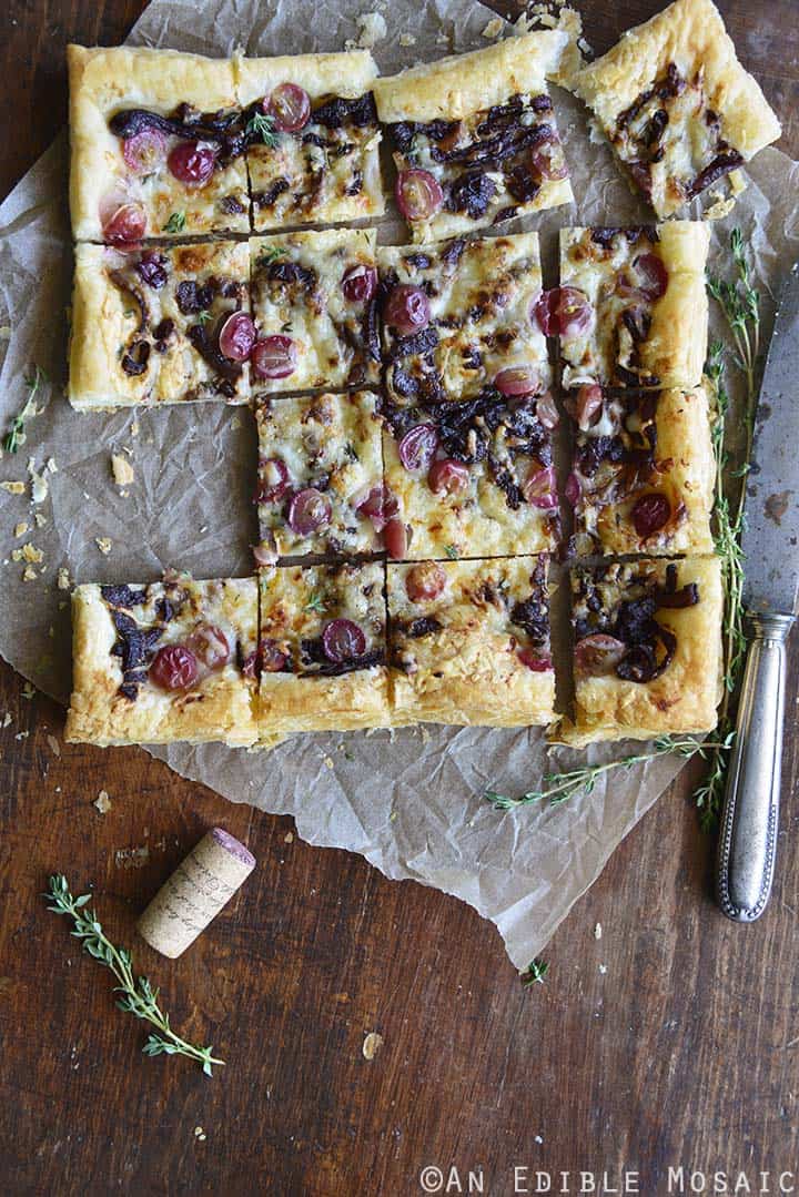 Easy Manchego, Grape, and Thyme Flatbread with Red Wine Caramelized Onions on Wooden Table
