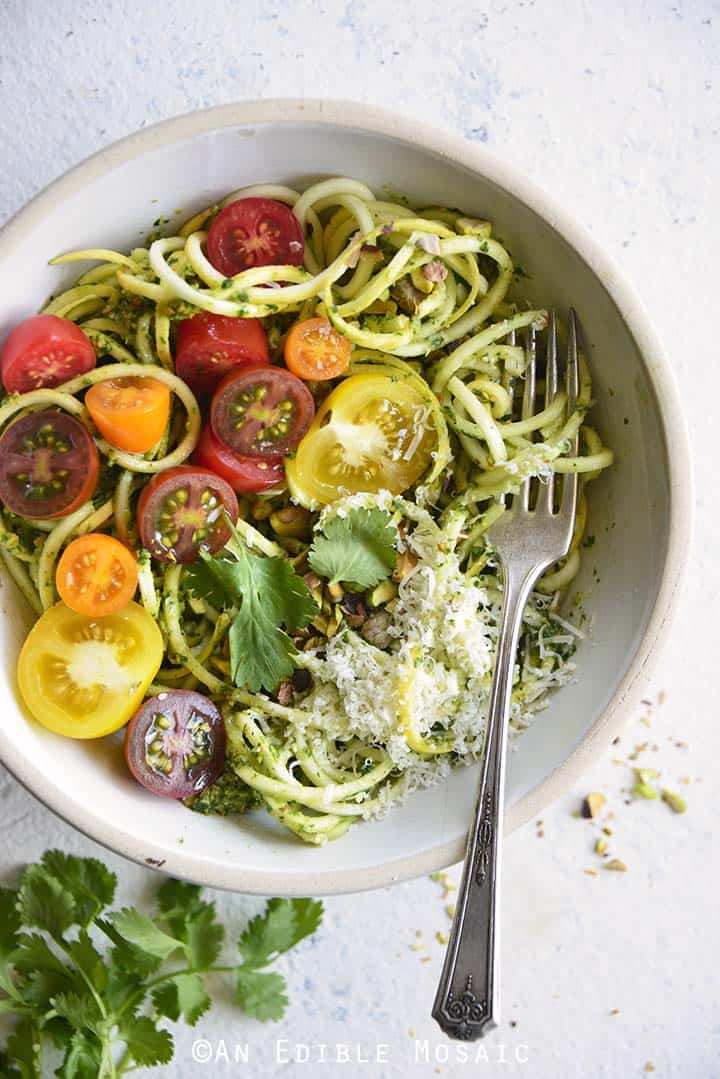 Low Carb Spiralized Yellow Squash Noodles with Tomatoes, Pesto, and Parmesan Close Up