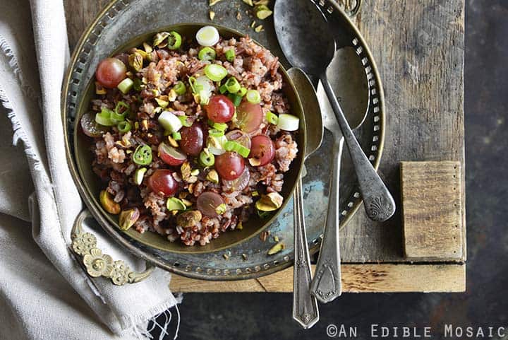 Close Up of Red Rice Recipe with Grapes and Pistachios