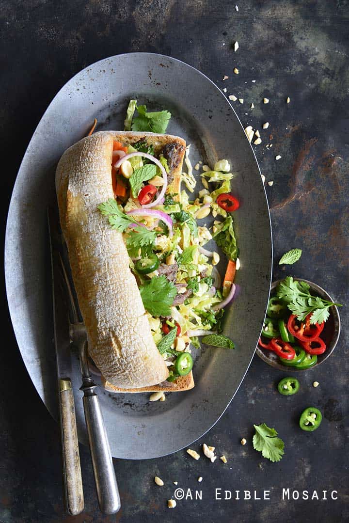 Overhead View of Banh Mi Sandwich with Instant Pot Short Ribs and Quick Pickled Slaw on Silver Plate