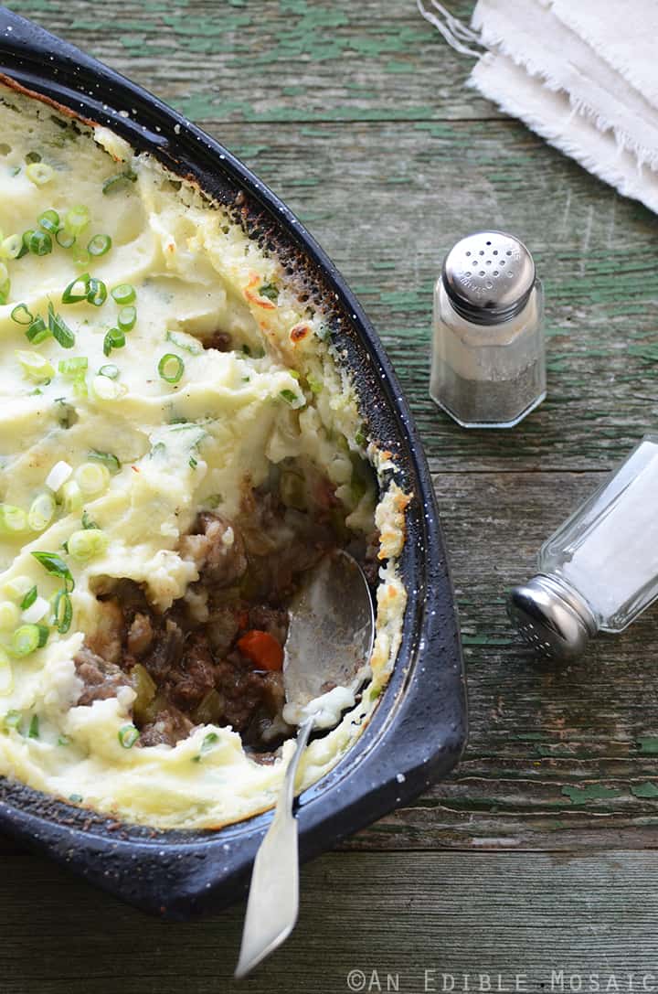 Champ-Topped Vegetable Beef Guinness Casserole on Green Table