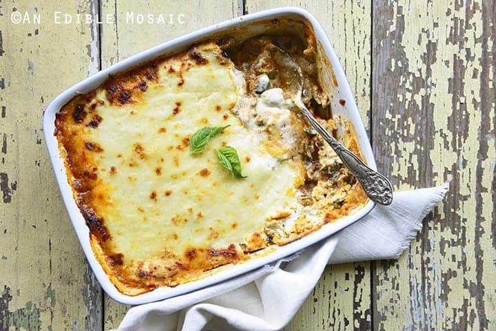 Low Carb Noodle Free Lasagna Recipe in White Casserole Dish with White Linen on Rustic Yellow Table