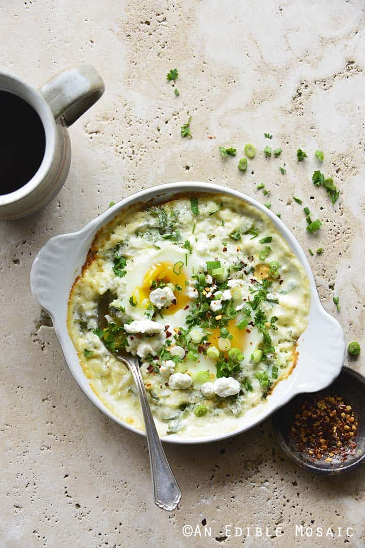 Overhead View of Herbed Eggs Baked in Cream with Feta with Cup of Coffee