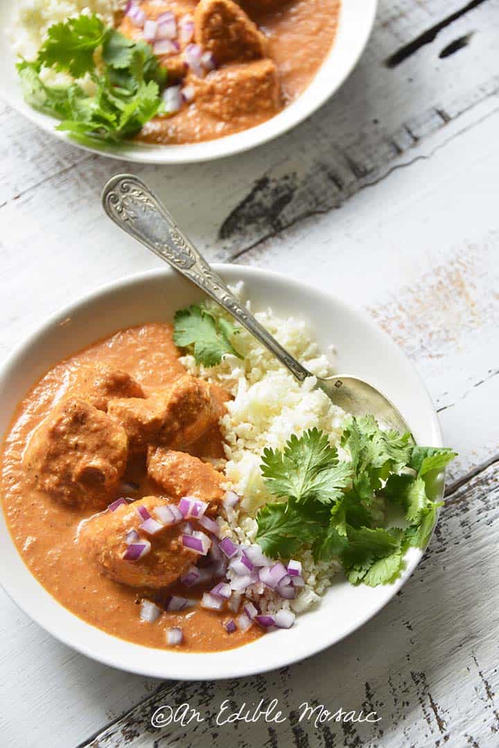 Close Up Overhead View at an Angle of Low Carb Indian Butter Chicken in White Bowl