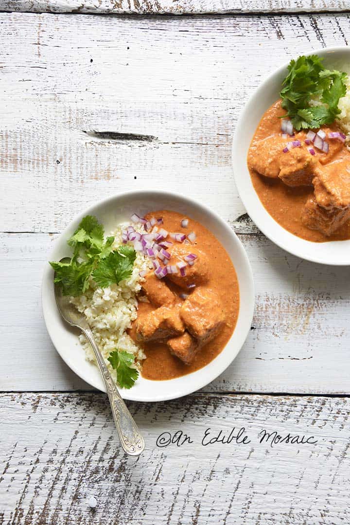 Overhead View of Low Carb Indian Butter Chicken Recipe on White Wood Table