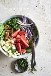 Overhead View of Spinach Strawberry Salad on Creamy Marble Background