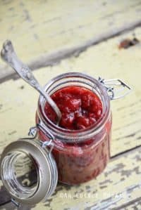 Jar of Sugar Free Strawberry Jam on Rustic Yellow Wooden Table