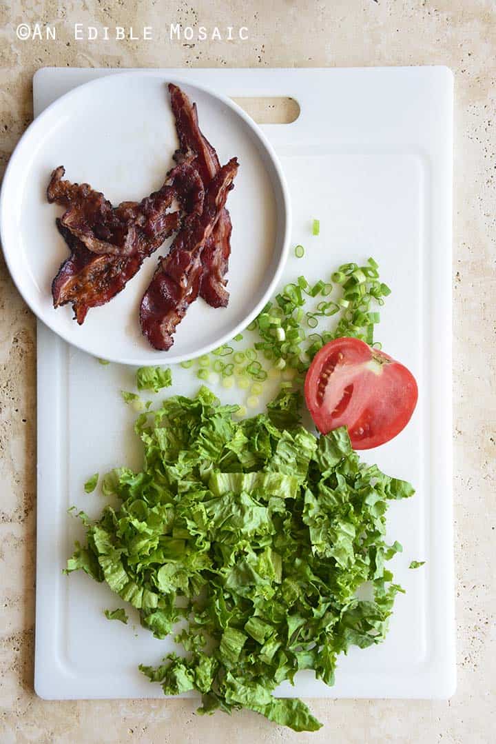 Bacon Lettuce Tomato Scallion on White Cutting Board