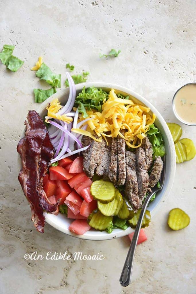 Overhead View of Cheeseburger Salad in a White Bowl