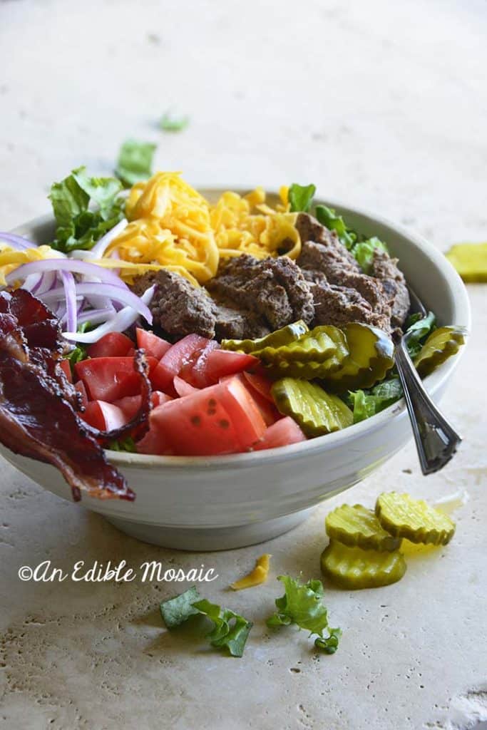 Front View of Cheeseburger Salad in Ceramic White Bowl