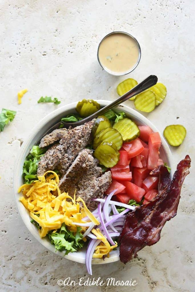 Cheeseburger Salad on Creamy White Marble Background