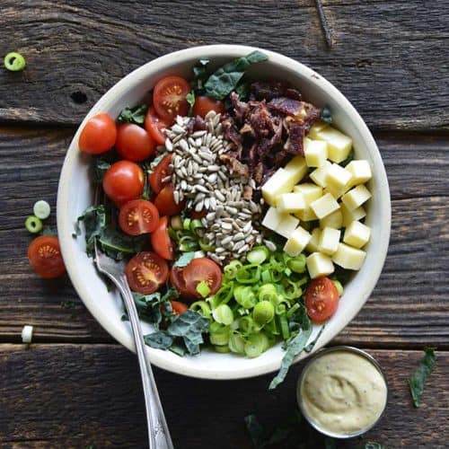 Overhead View of Chopped Kale Salad on Rustic Dark Wood Table