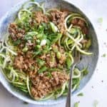 Dan Dan Noodles in Blue and White Bowl on White Marble Countertop