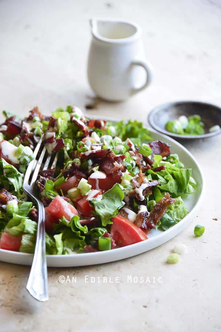 Front View of Bacon Lettuce Tomato Salad with Fork on Plate