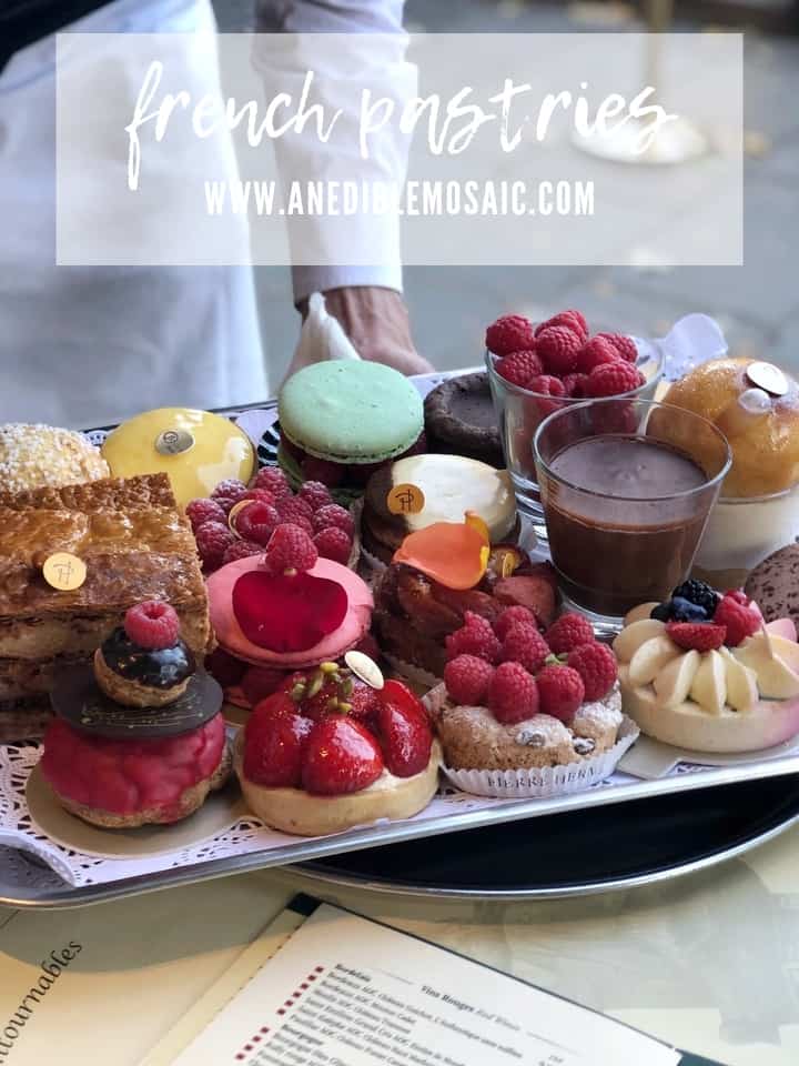 Waiter Holding a Tray of French Pastries