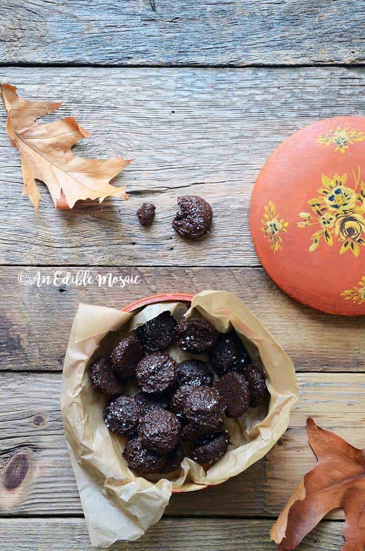 Salted Dark Chocolate Cookies with Autumn Leaves on Wooden Table