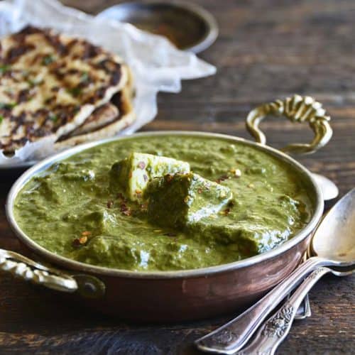 Palak Paneer Recipe (Indian Spinach Curry with Paneer Cheese) Close Up Front View on Wooden Table