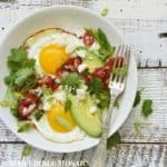 Overhead View of Egg Skillet Breakfast in White Bowl with Fork