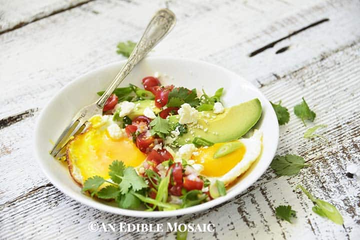 Egg Skillet Breakfast Recipe with Runny Yolk in White Bowl