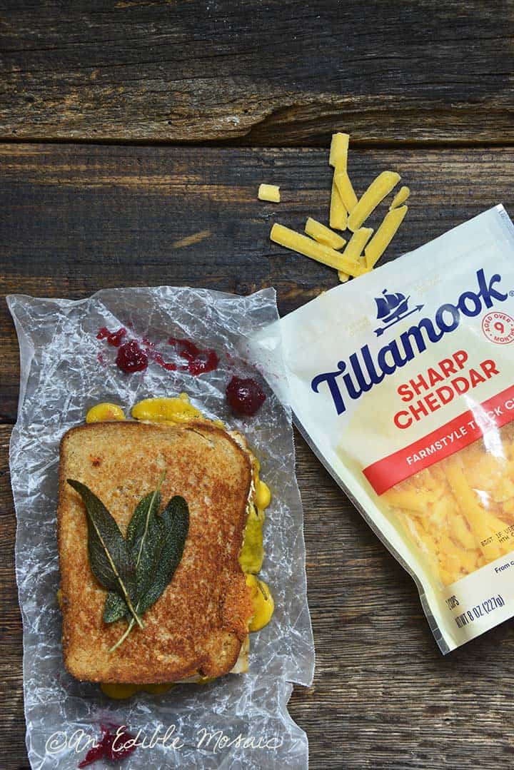 Grilled Cheese Thanksgiving Leftovers Sandwich on Wooden Table with Tillamook Cheese in Package
