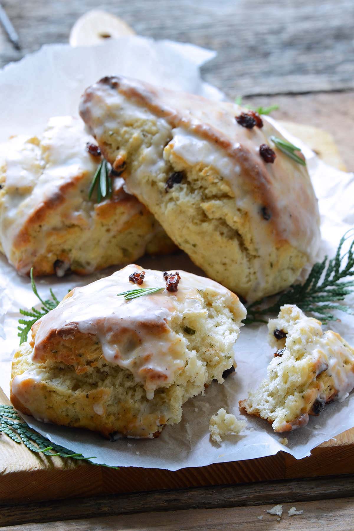 Christmas morning scones on cutting board with one partially eaten to show fluffy texture inside
