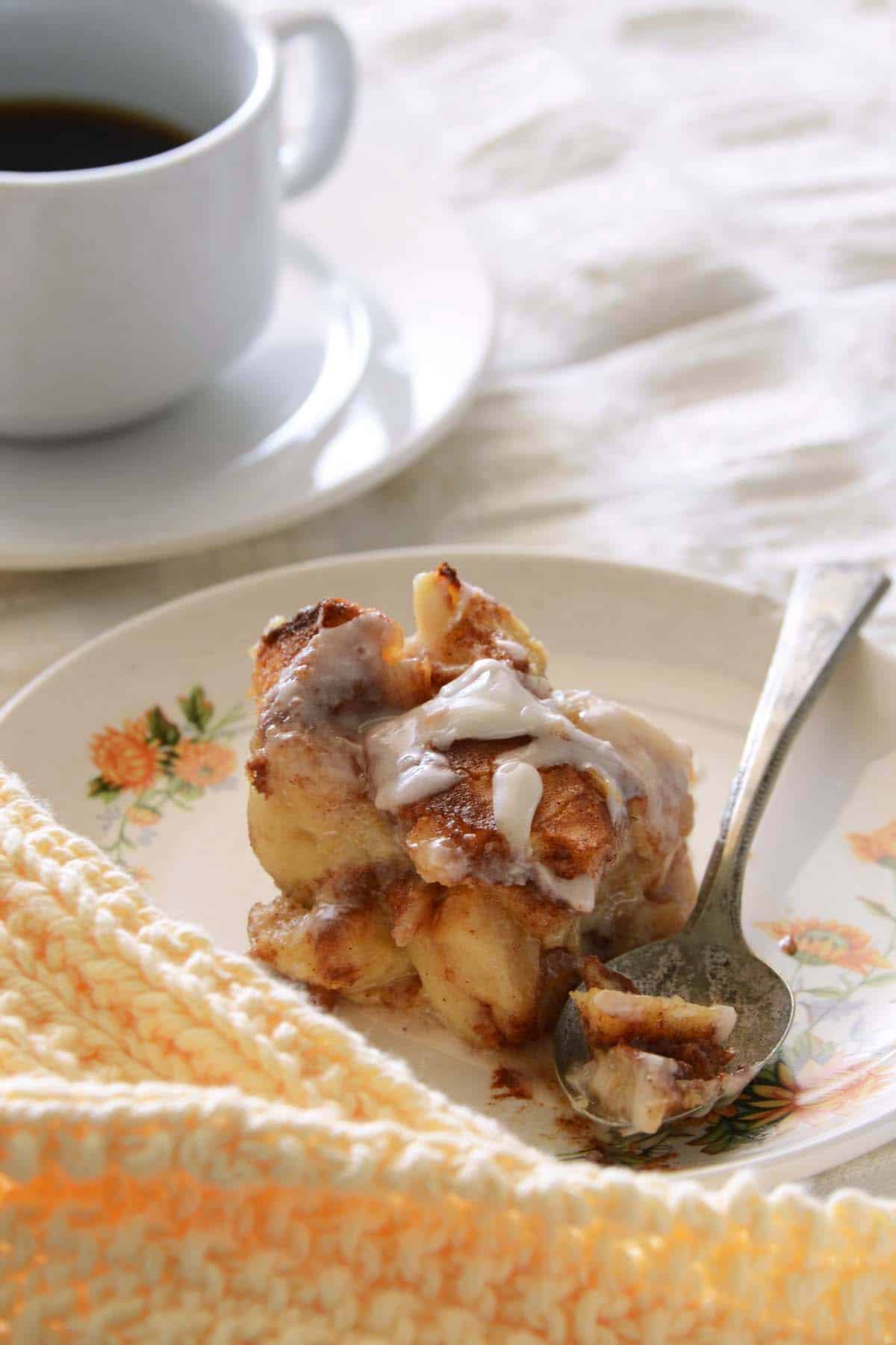 serving of cinnamon bun bread pudding on flowered plate