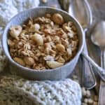 Granola in White Ceramic Bowl with Vintage Spoons