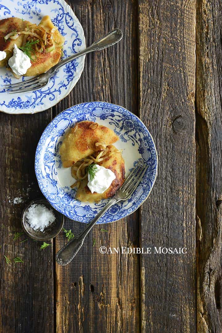 Keto Pierogi Recipe on Blue and White Flowered Plates on Dark Wooden Table