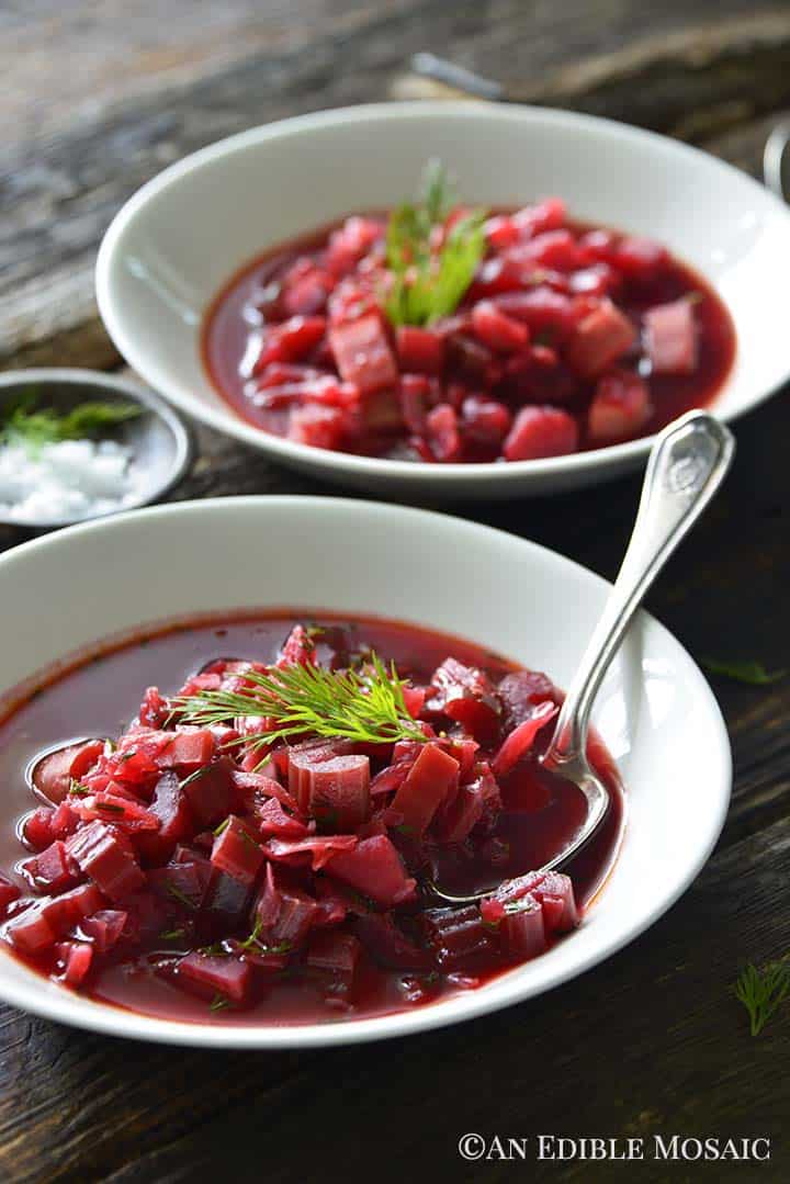 Front View of Bowls of Vegetarian Borscht Soup on Dark Wooden Table