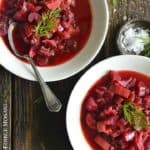 Close Up Overhead View of Vegetarian Borscht Soup in White Bowls