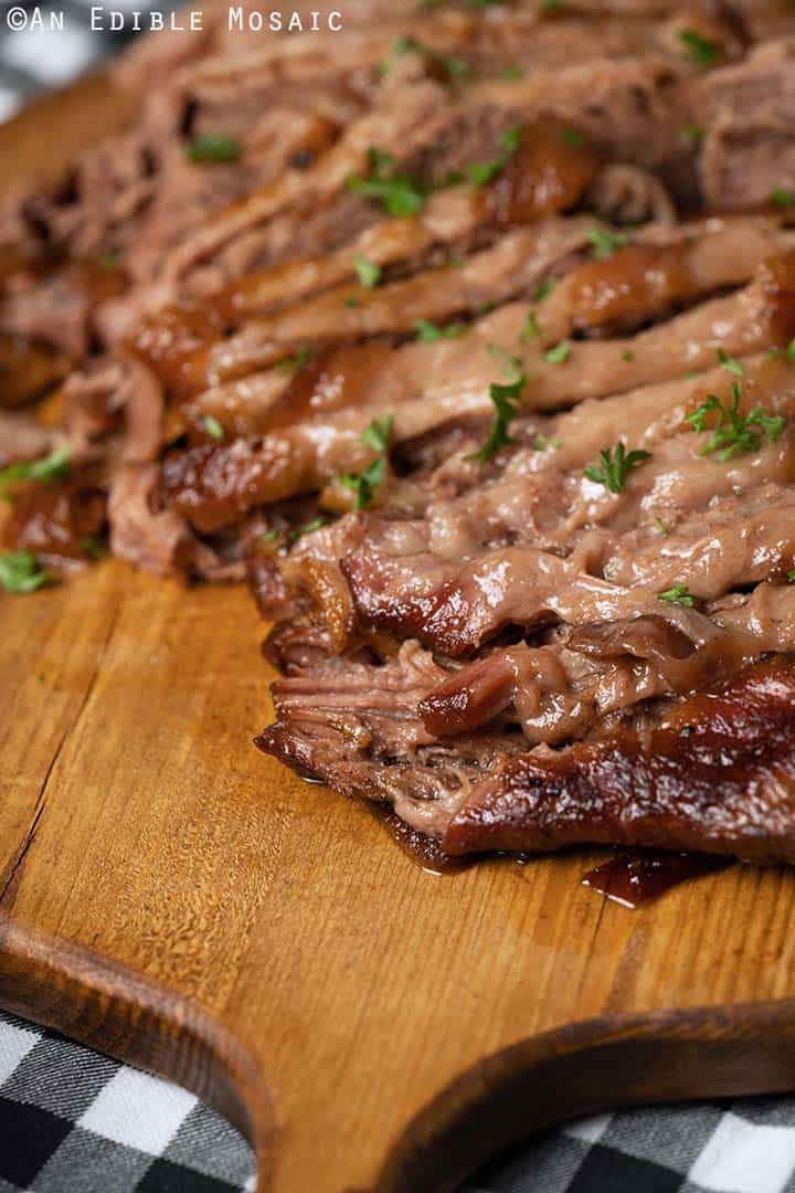 Front View of Sliced Beef Brisket on Wooden Cutting Board