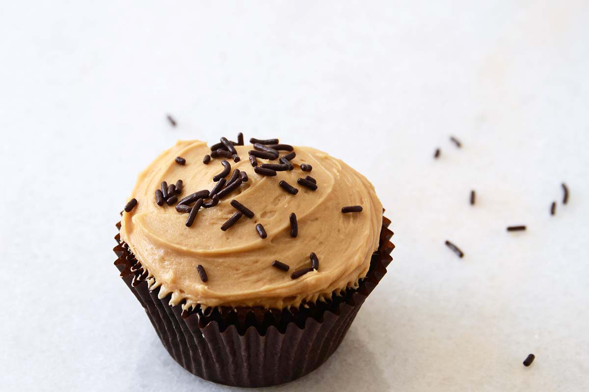 guinness cupcake with caramel frosting and chocolate sprinkles