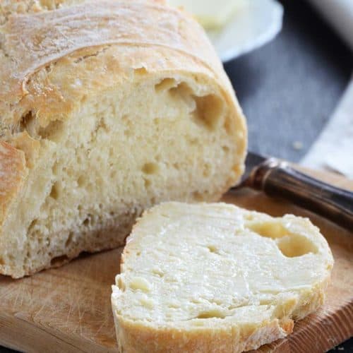 Close Up Front View of a Slice of No Knead Bread with Butter