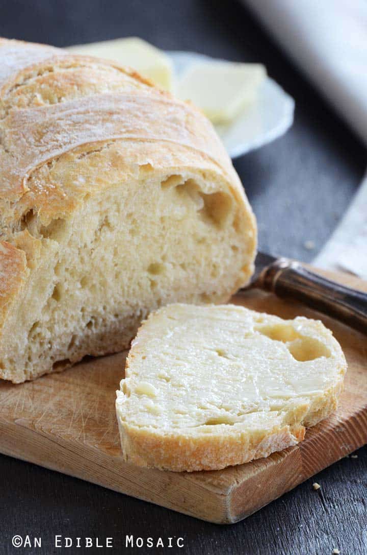 Close Up Front View of a Slice of No Knead Bread with Butter