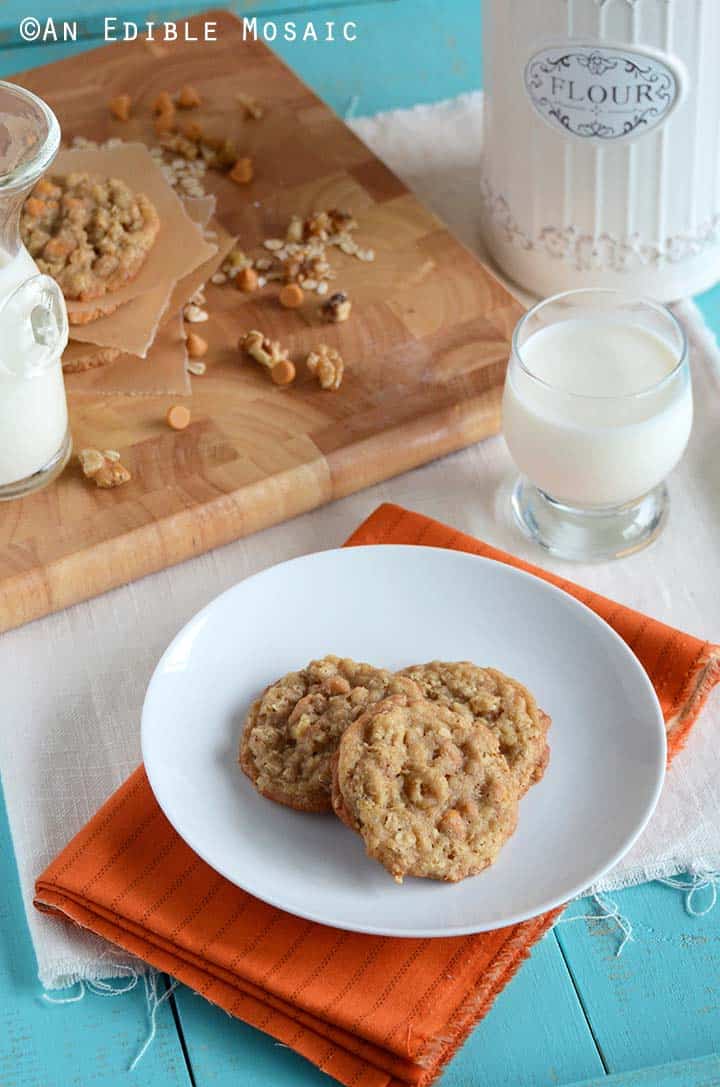 Oatmeal Scotchies Cookies on White Plate with Glass of Milk