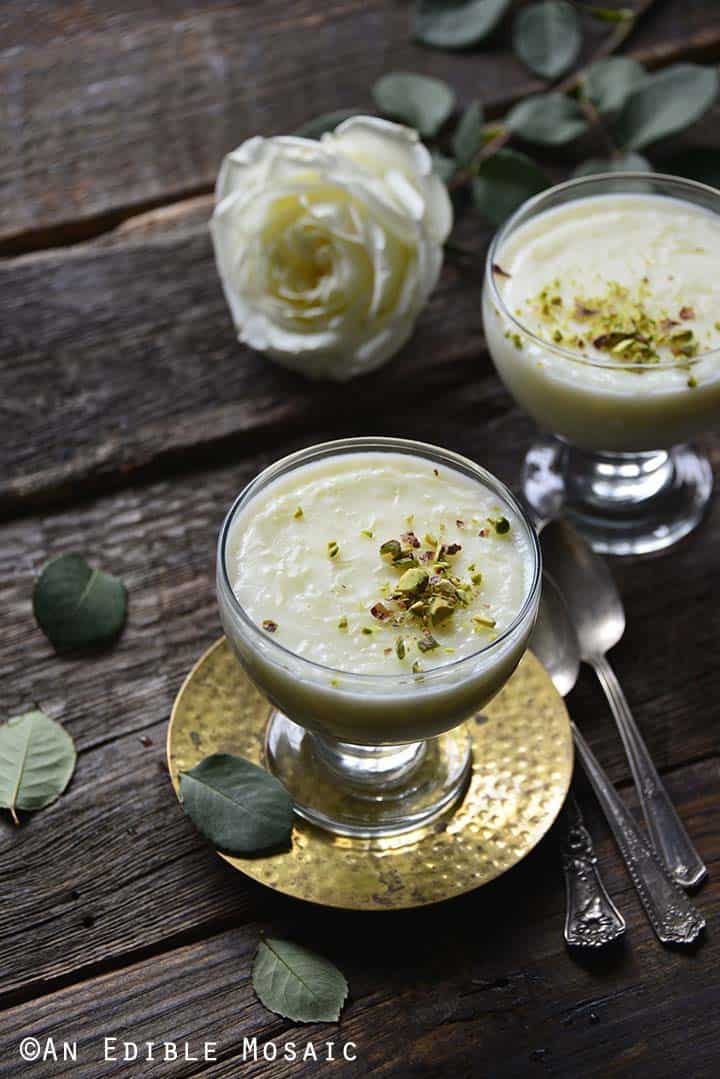 Rice Pudding in Glasses on Dark Table with White Roses