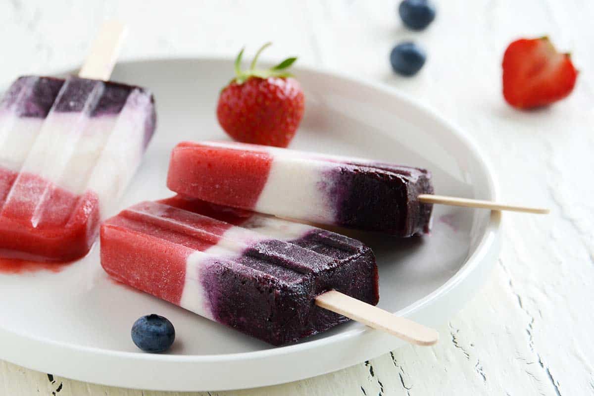 fourth of july popsicles on white plate