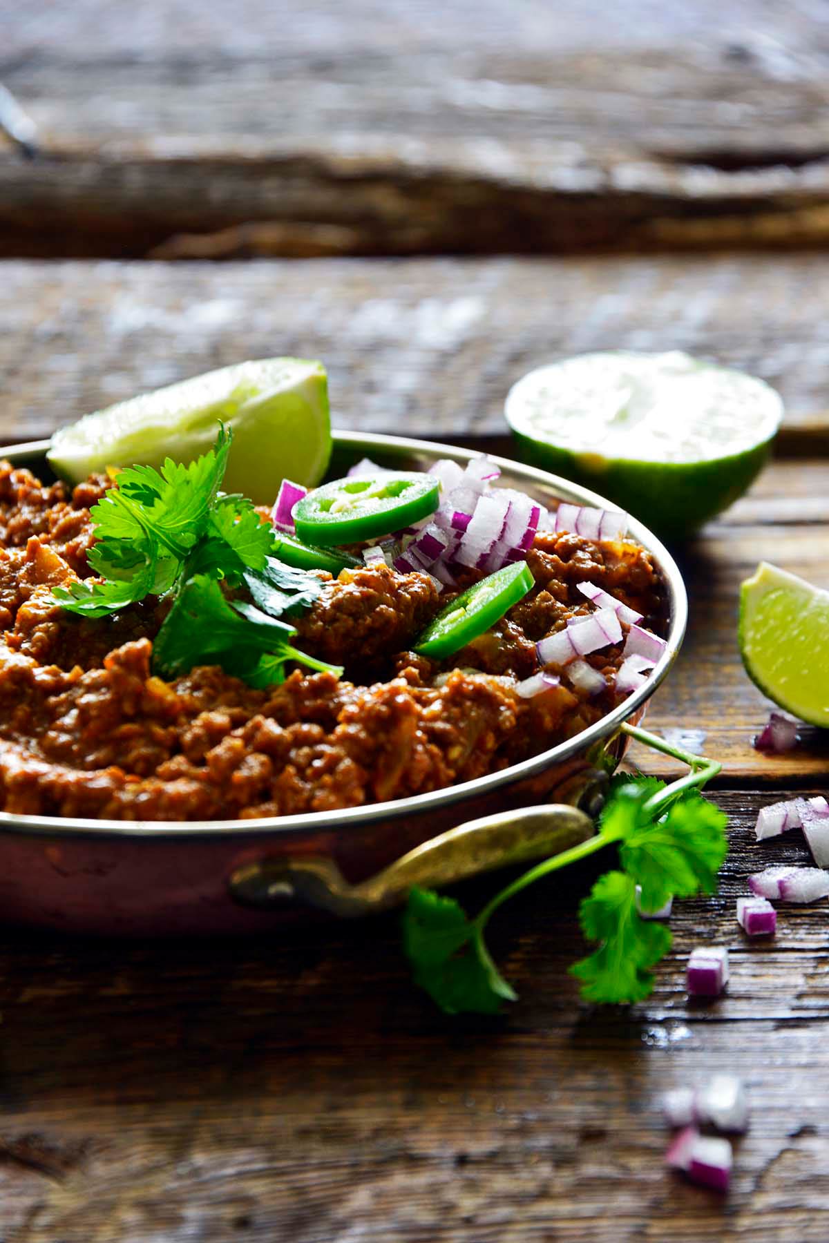 front view of dish of Kheema Pav made with mutton lamb chicken or beef meat mince