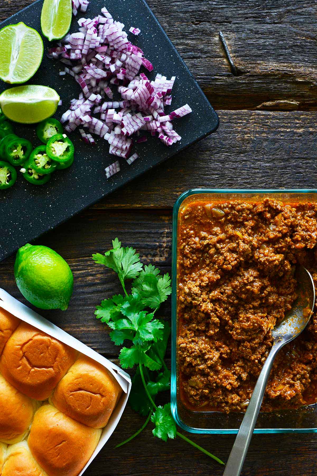 Indian street food spread Mumbai style with keema pad sloppy Joe meat and buttered toasted slider rolls