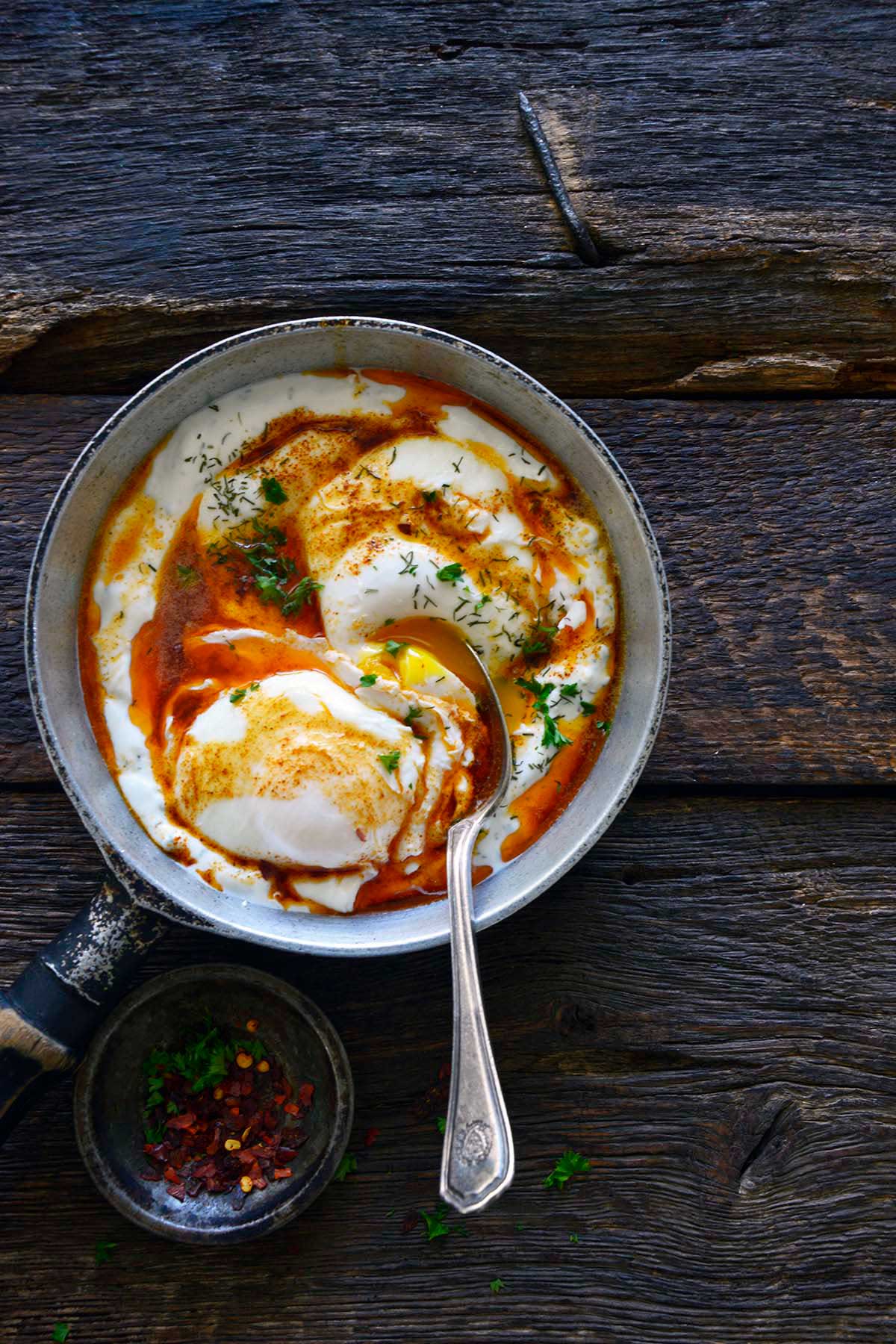 Turkish Cilbir poached eggs on garlic yogurt