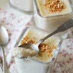 Small Glass Dishes of Brown Rice Pudding Recipe with Spoon on Top of One Dish