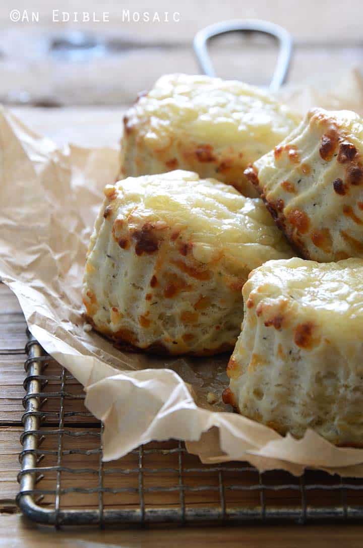 Close Up Front View of Cheese and Thyme Scones on Wooden Table