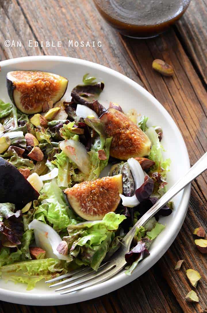 Close Up of Fig Salad with Fork on White Plate