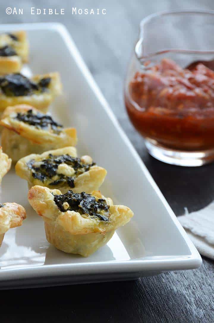 Spanakopita Puff Pastry Bites on White Platter